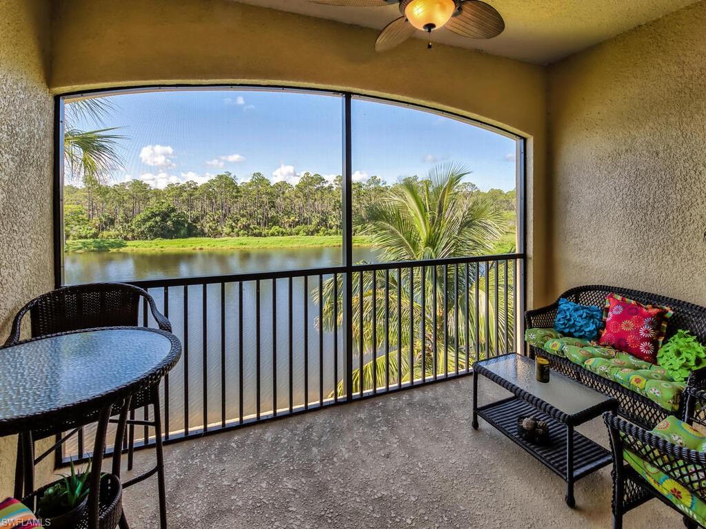 9735 Acqua Court, Unit 635 Naples, FL 34113 - Photo 19 of 33 a view of a chairs and table in the patio