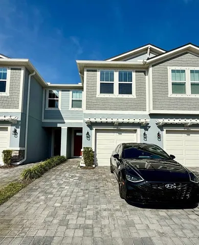 a view of a car parked in front of a building