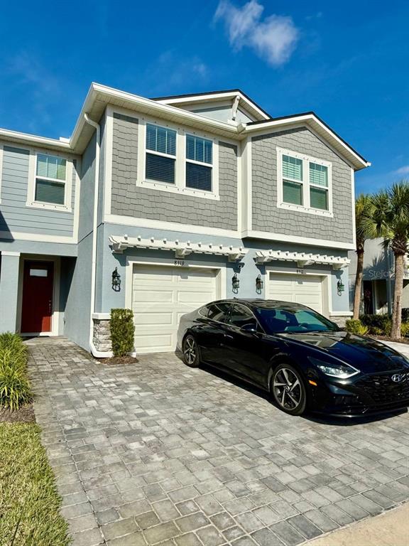 8319 Wildflower Glen Avenue Odessa, FL 33556 - Photo 2 of 34 a car parked in front of a house