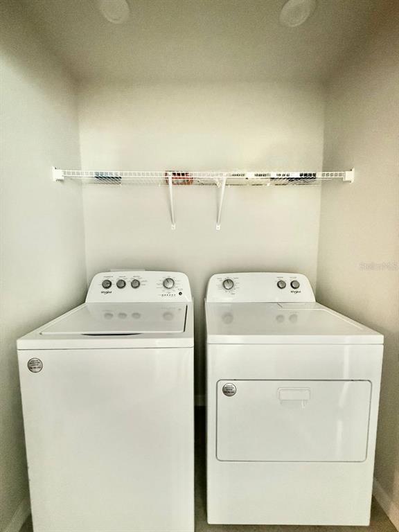 8319 Wildflower Glen Avenue Odessa, FL 33556 - Photo 31 of 34 a utility room with dryer and washer