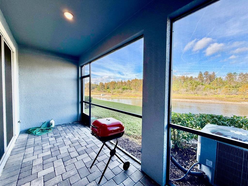 8319 Wildflower Glen Avenue Odessa, FL 33556 - Photo 33 of 34 a view of balcony with furniture