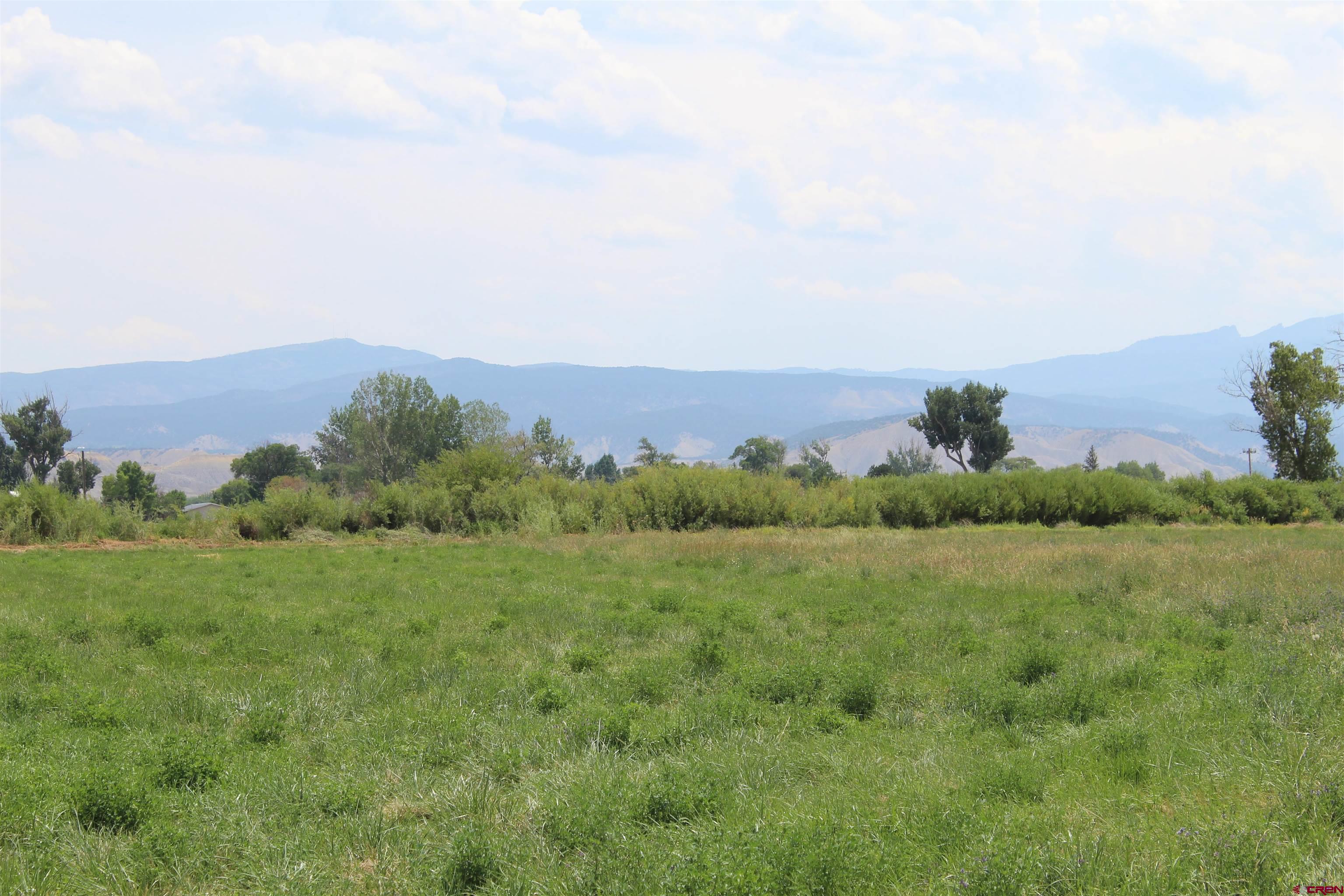 Lot 3 Solar Road Montrose, CO 81403 - Photo 2 of 8 an aerial view of mountain with trees around