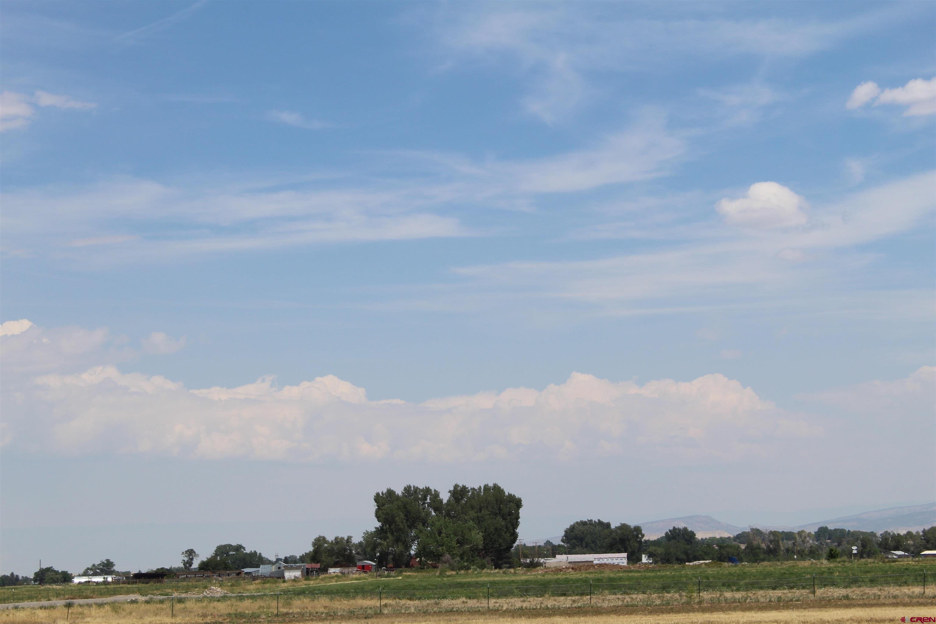 Lot 3 Solar Road Montrose, CO 81403 - Photo 7 of 8 a view of lake with mountain in the back