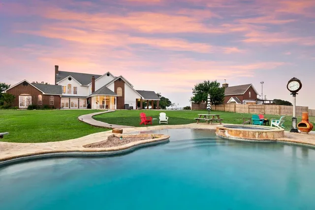 a front view of house with yard and green space