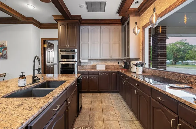 a living room with furniture and a ceiling fan