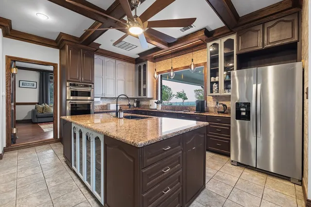 a living room with furniture a flat screen tv and a table