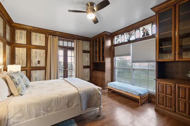 a bathroom with a sink a bathtub and next to a window