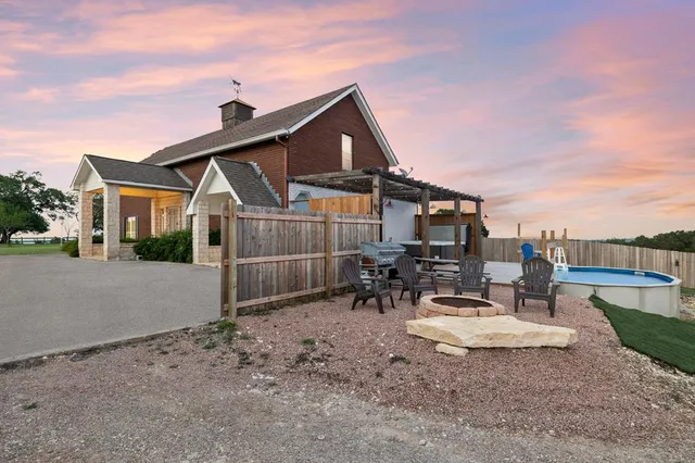 a view of a park with large trees