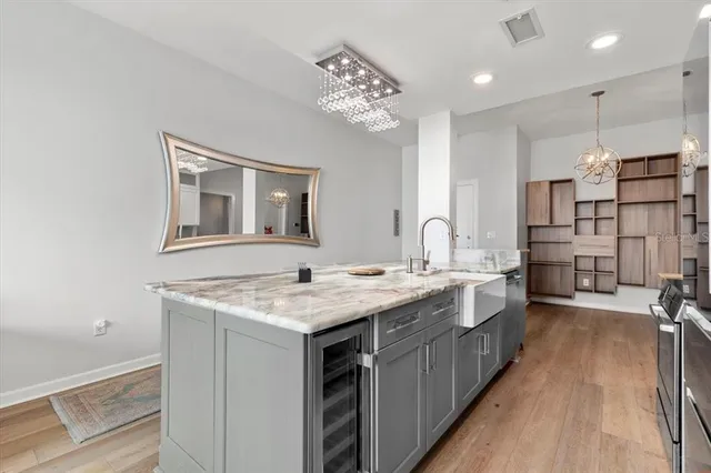 a kitchen with a sink stove and cabinets