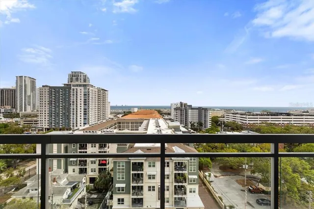 a view of a tall building from a balcony