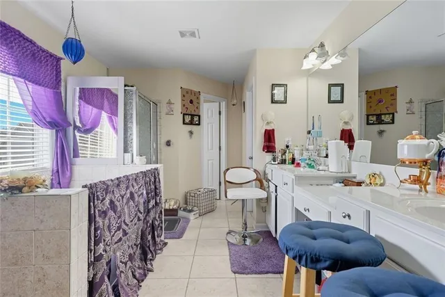 a kitchen with stainless steel appliances granite countertop a refrigerator and a stove