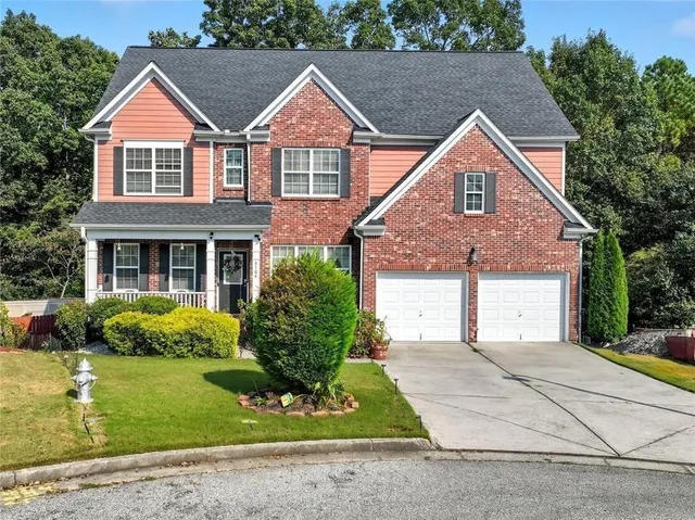 front view of a house with a yard