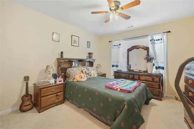 a bedroom with a bed and a mirror