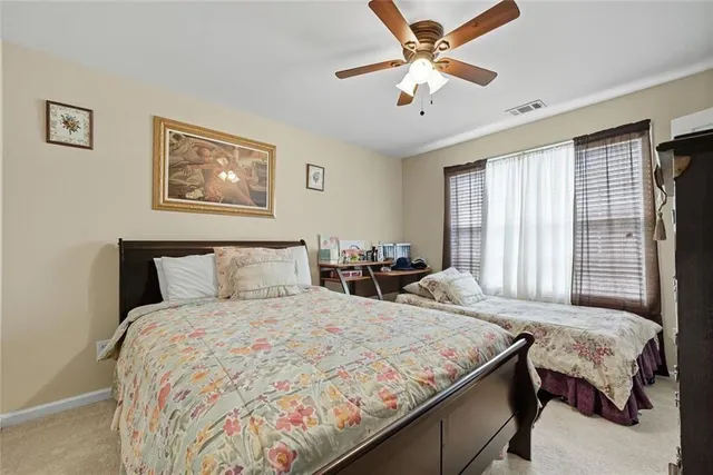 a bedroom with a bed and hallway