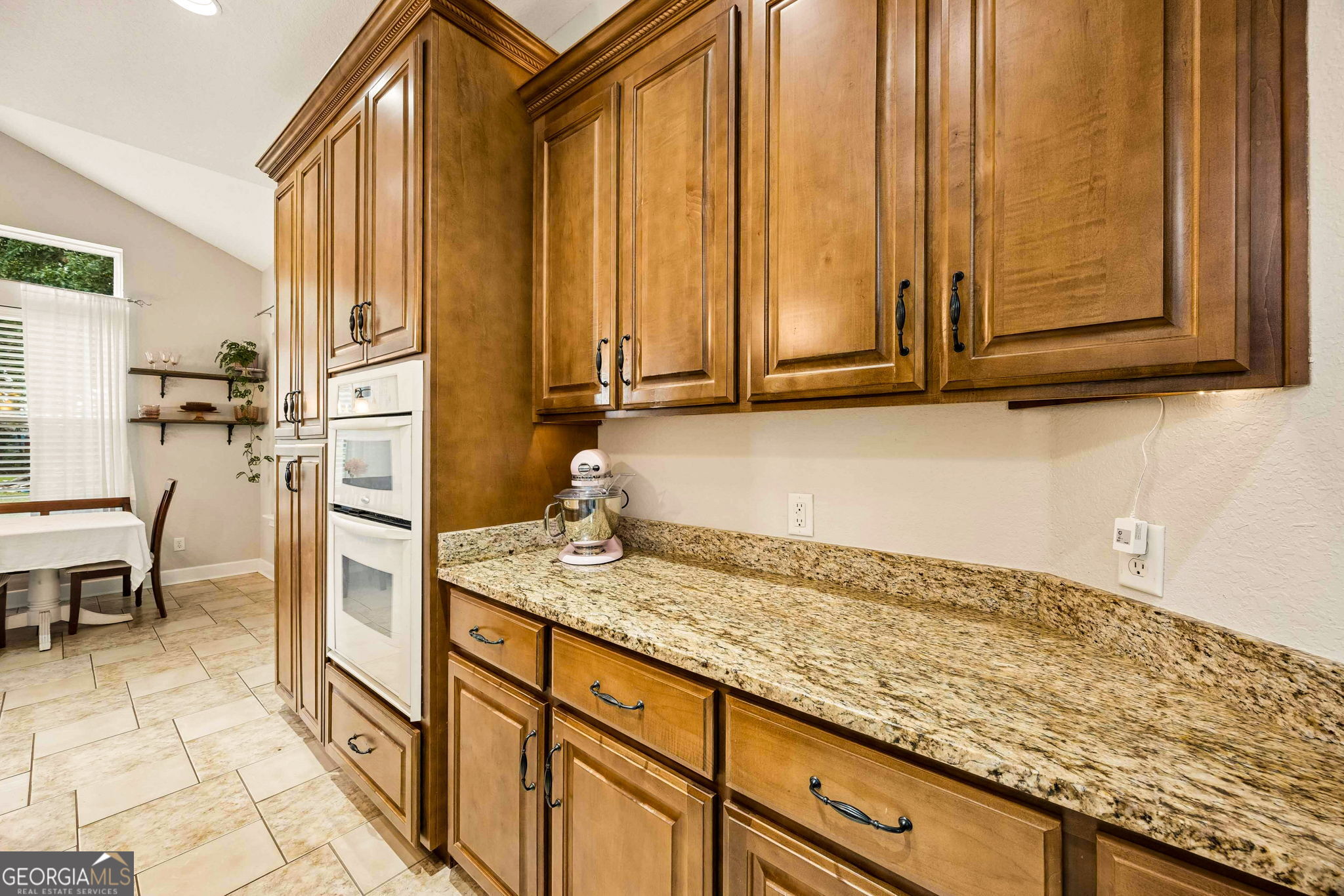 706 Hopewell Point Road White Oak, GA 31568 - Photo 22 of 84 Generous granite countertops, extensive cabinet storage, and built-in appliances provide the workspace and organization today's homeowners desire.