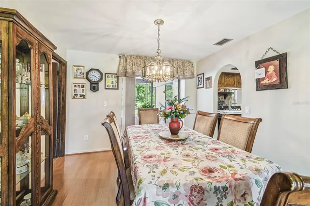 a bedroom with furniture and a chandelier