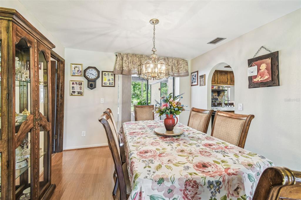 6938 Coronet Drive New Port Richey, FL 34655 - Photo 19 of 49 a bedroom with furniture and a chandelier