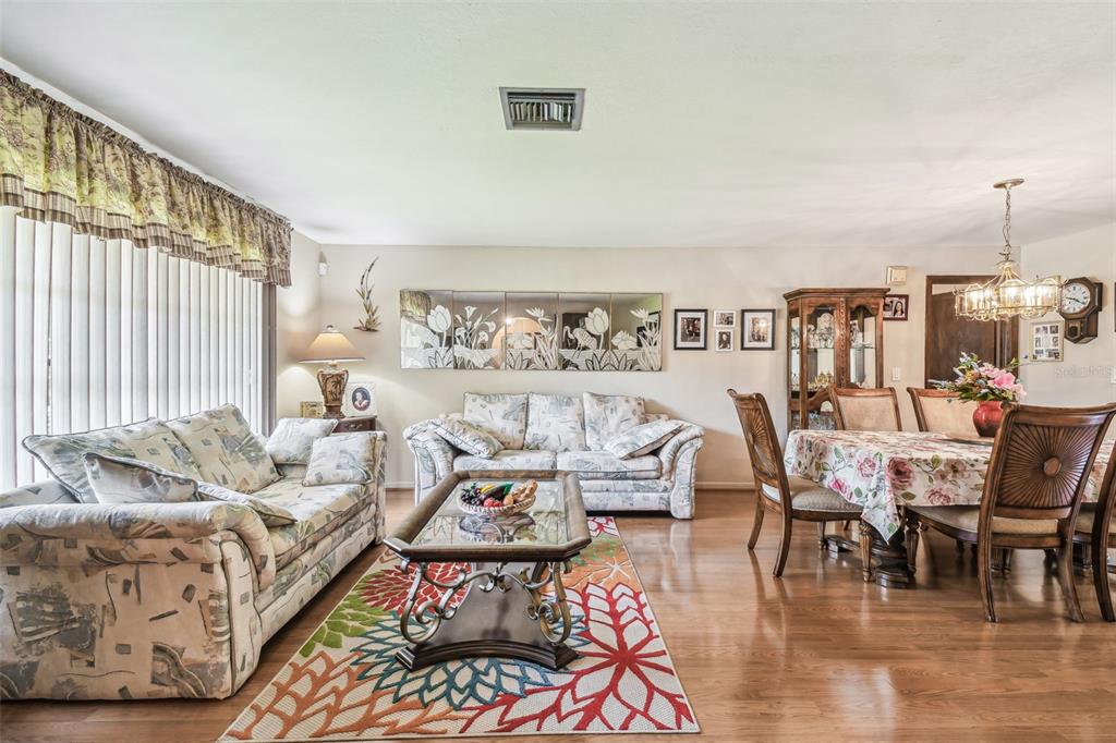 6938 Coronet Drive New Port Richey, FL 34655 - Photo 20 of 49 a living room with furniture and a large window