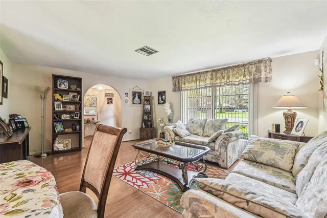 a living room with furniture and a large window