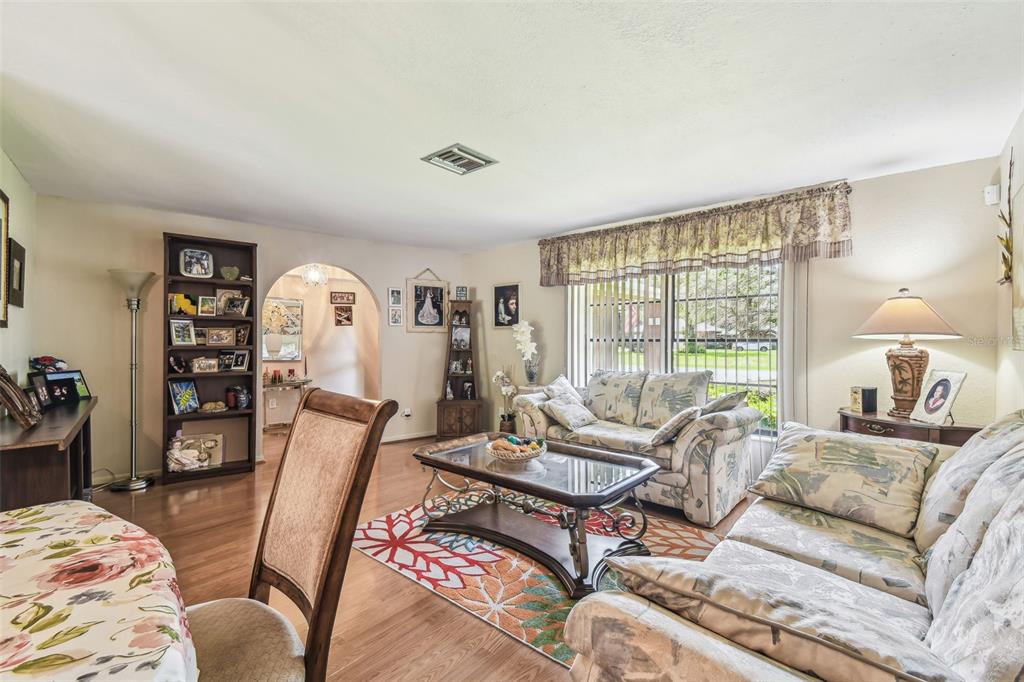 6938 Coronet Drive New Port Richey, FL 34655 - Photo 21 of 49 a living room with furniture and a large window