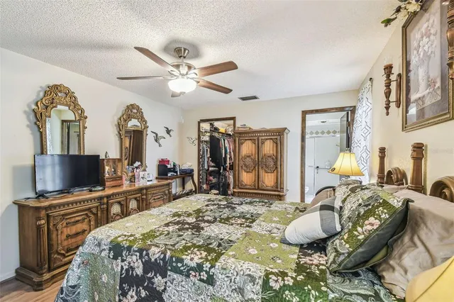 a bed room with a bed and a television