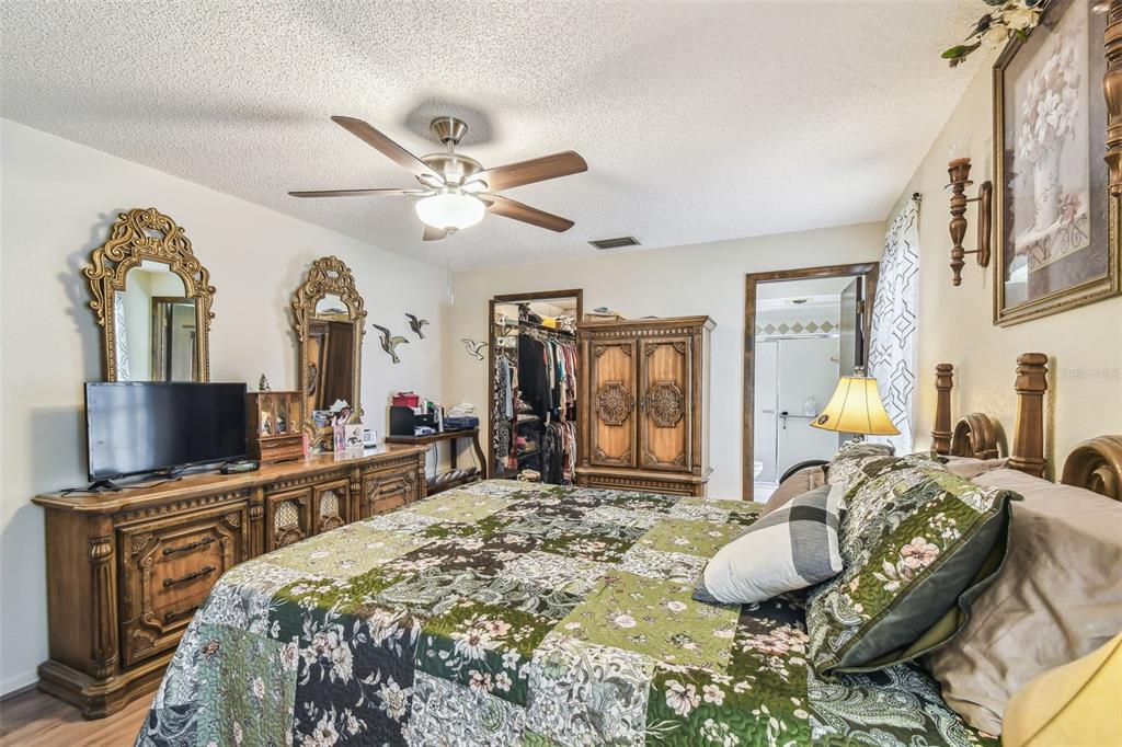 6938 Coronet Drive New Port Richey, FL 34655 - Photo 23 of 49 a bed room with a bed and a television