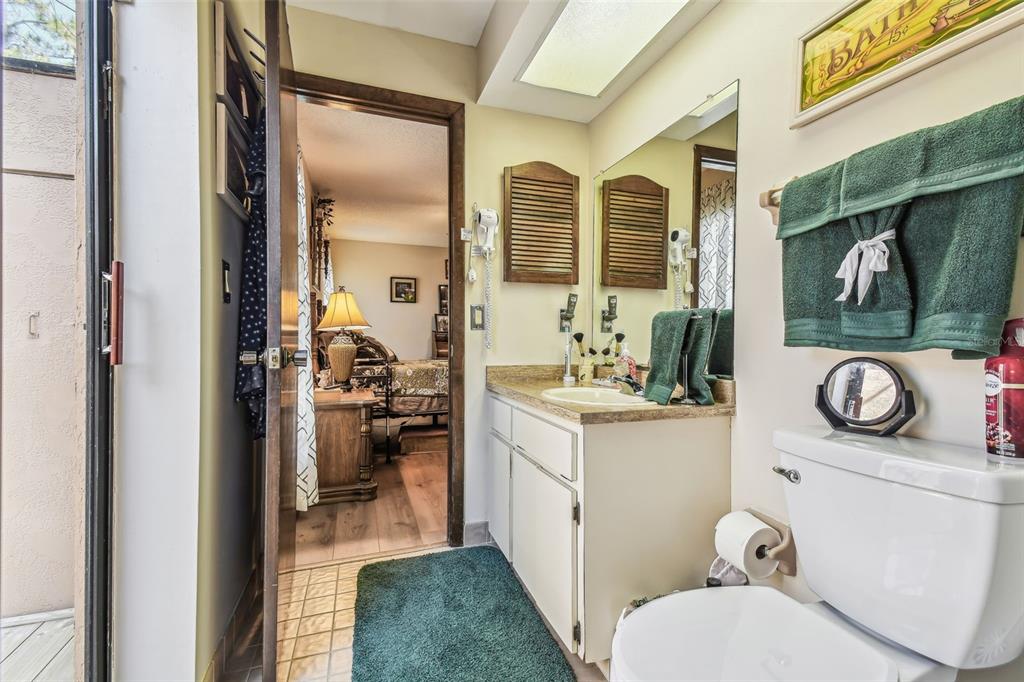 6938 Coronet Drive New Port Richey, FL 34655 - Photo 26 of 49 a bathroom with a sink toilet and tub