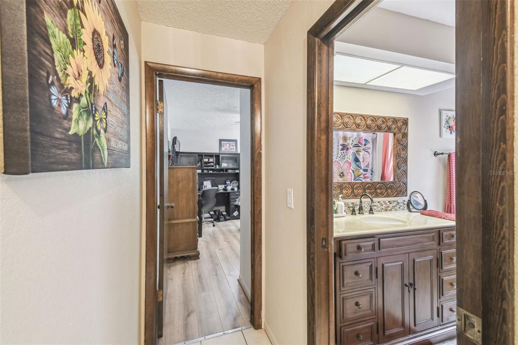 6938 Coronet Drive New Port Richey, FL 34655 - Photo 29 of 49 a bathroom with a sink and a mirror