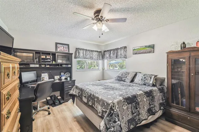 a bedroom with a bed furniture and a window