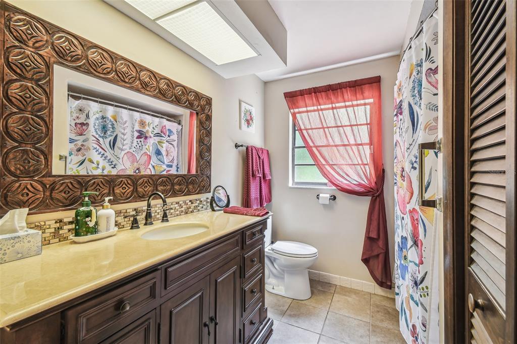 6938 Coronet Drive New Port Richey, FL 34655 - Photo 31 of 49 a bathroom with a sink and a mirror