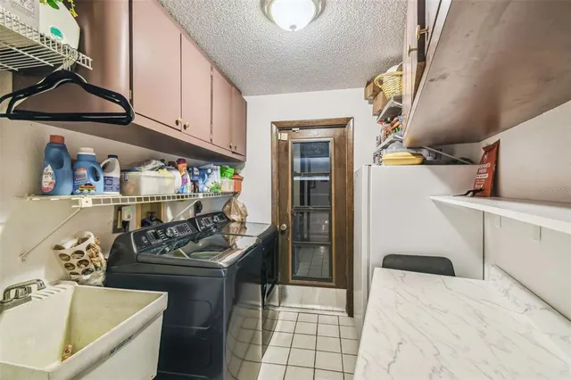 a kitchen that has a sink and a stove