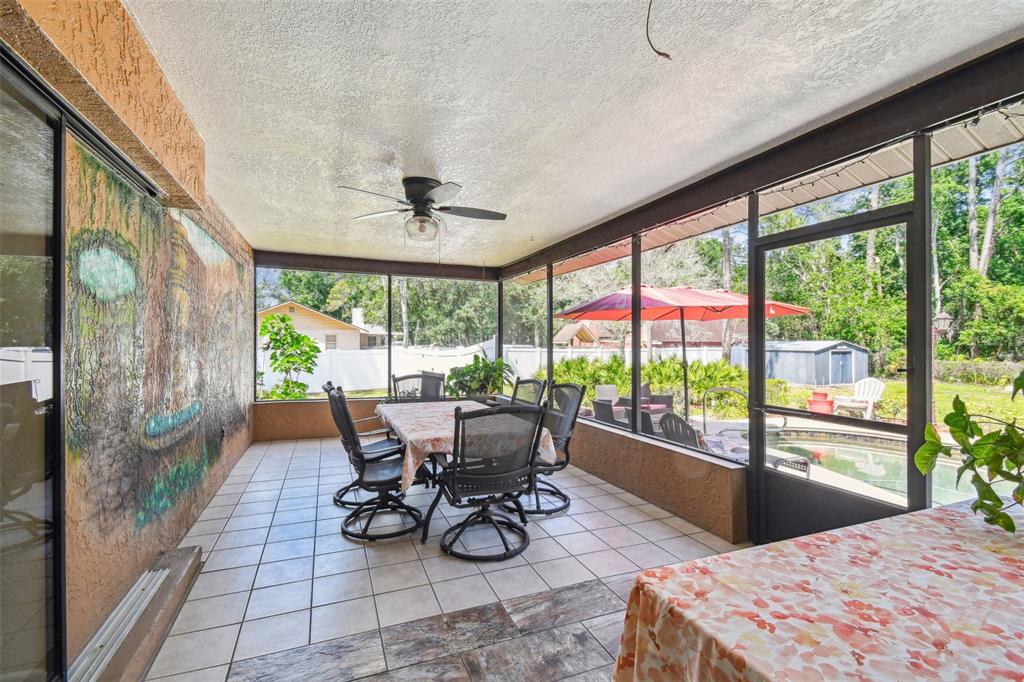 6938 Coronet Drive New Port Richey, FL 34655 - Photo 33 of 49 a view of a dining room with furniture window and outside view