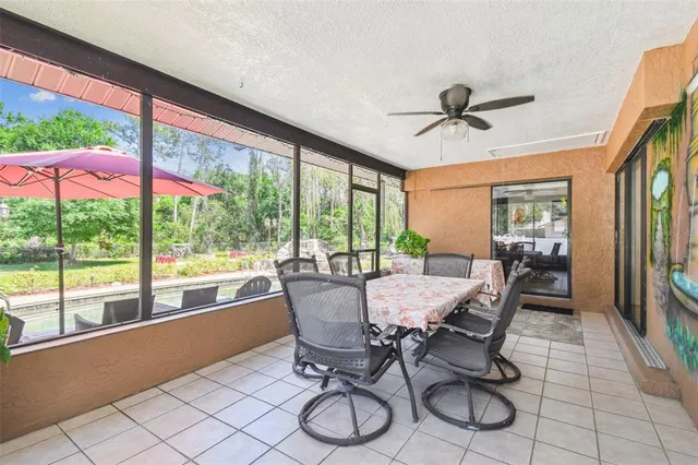 a view of a dining room with furniture window and outside view