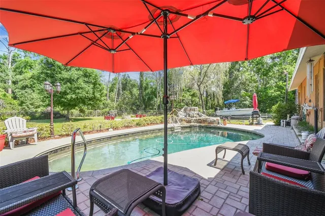 a view of a patio with a table and chairs