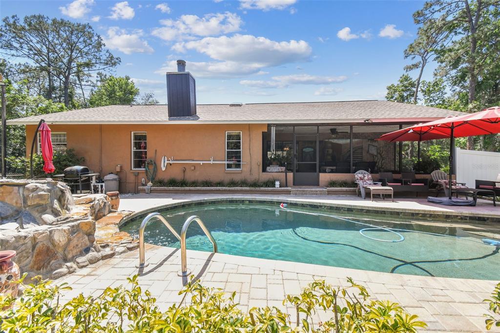6938 Coronet Drive New Port Richey, FL 34655 - Photo 38 of 49 a view of a swimming pool with a patio