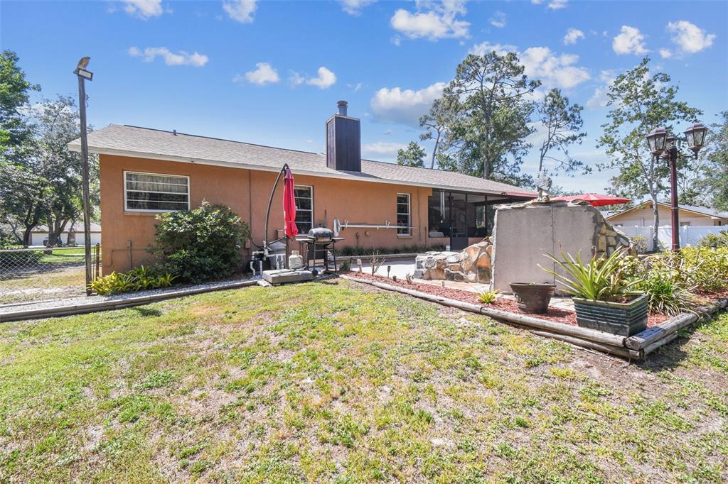 6938 Coronet Drive New Port Richey, FL 34655 - Photo 39 of 49 a view of a house with swimming pool and sitting area