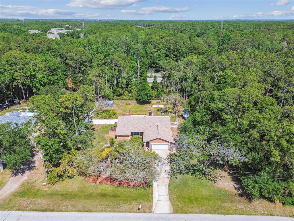 6938 Coronet Drive New Port Richey, FL 34655 - Photo 49 of 49 an aerial view of a house with a yard