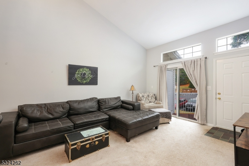 28 Spruce Court Bedminster, NJ 07921 - Photo 4 of 12 a living room with furniture and a flat screen tv