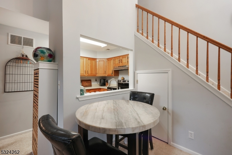 28 Spruce Court Bedminster, NJ 07921 - Photo 6 of 12 a view of livingroom and dining room with wooden floor