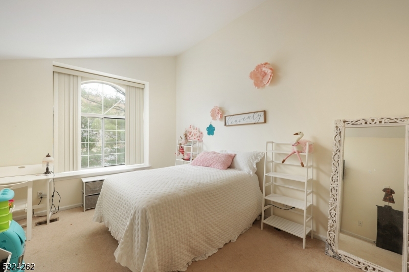 28 Spruce Court Bedminster, NJ 07921 - Photo 10 of 12 a bedroom with a bed and a window