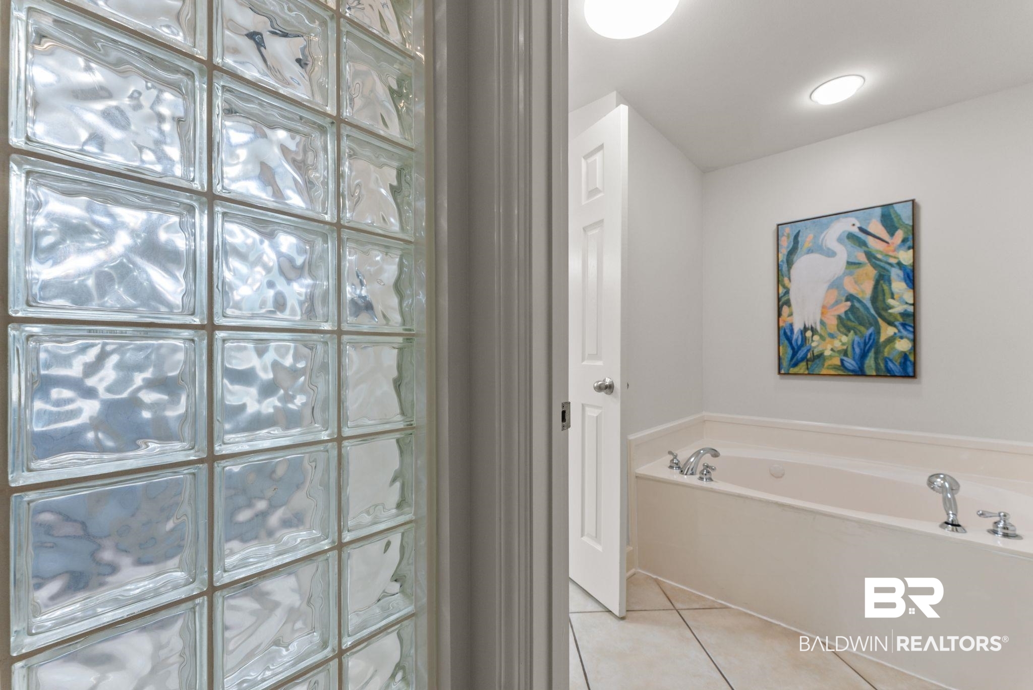 27580 Canal Road, Unit 1233 Orange Beach, AL 36561 - Photo 19 of 79 Bathroom with a bath and light tile patterned floors
