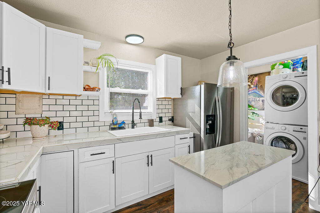 1506 South 2nd Avenue Yakima, WA 98902 - Photo 11 of 28 a kitchen with refrigerator a stove a sink a chimney and a refrigerator