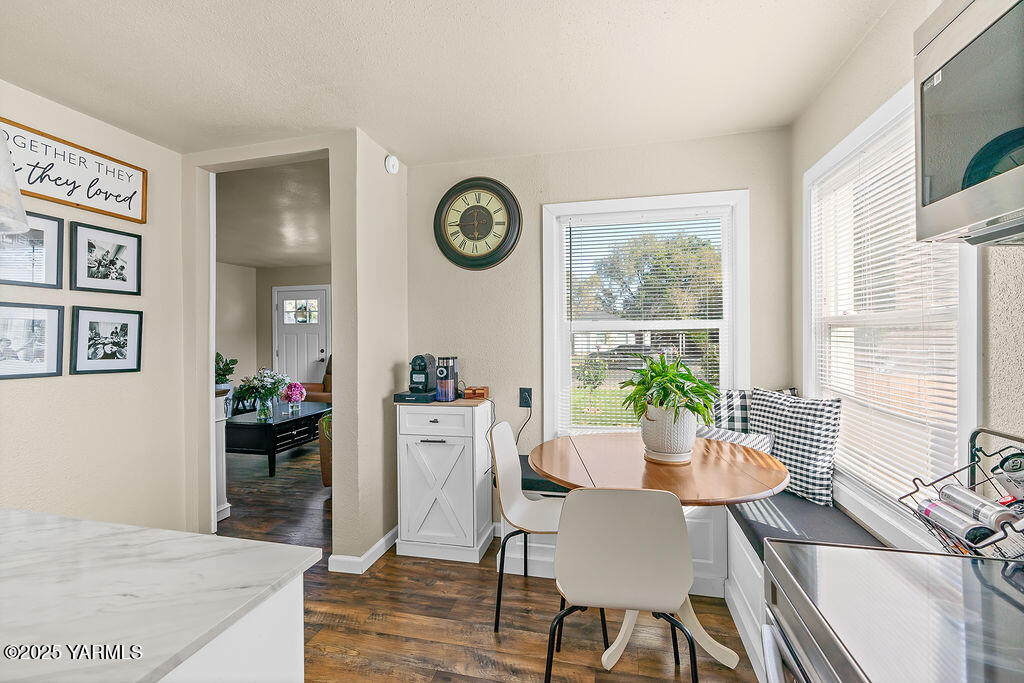 1506 South 2nd Avenue Yakima, WA 98902 - Photo 10 of 28 a view of a dining room with furniture and wooden floor