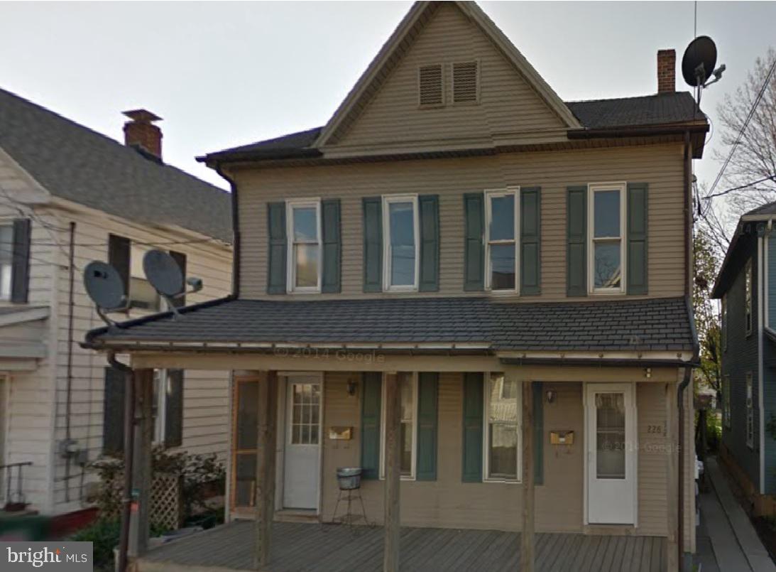 226 Poplar Street Hanover, PA 17331 - Photo 4 of 4 a front view of a house with barbeque grill and seating space