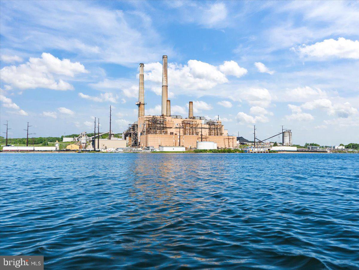 663 Bear Woods Road Mount Storm, WV 26739 - Photo 69 of 73 Industrial power plant by serene waters.