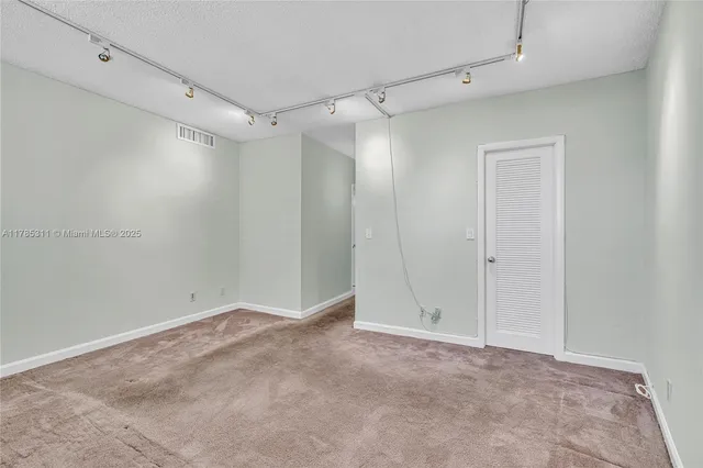 a view of a swimming pool with a table and chairs