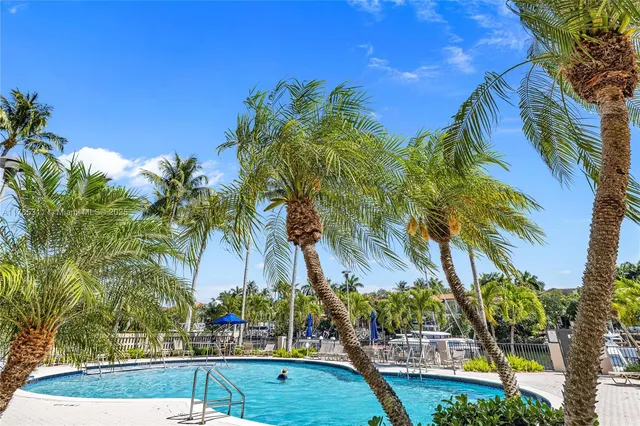 a living room with furniture a rug and a large window