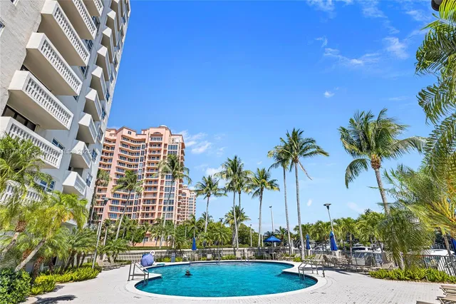 a living room with furniture a rug and a flat screen tv