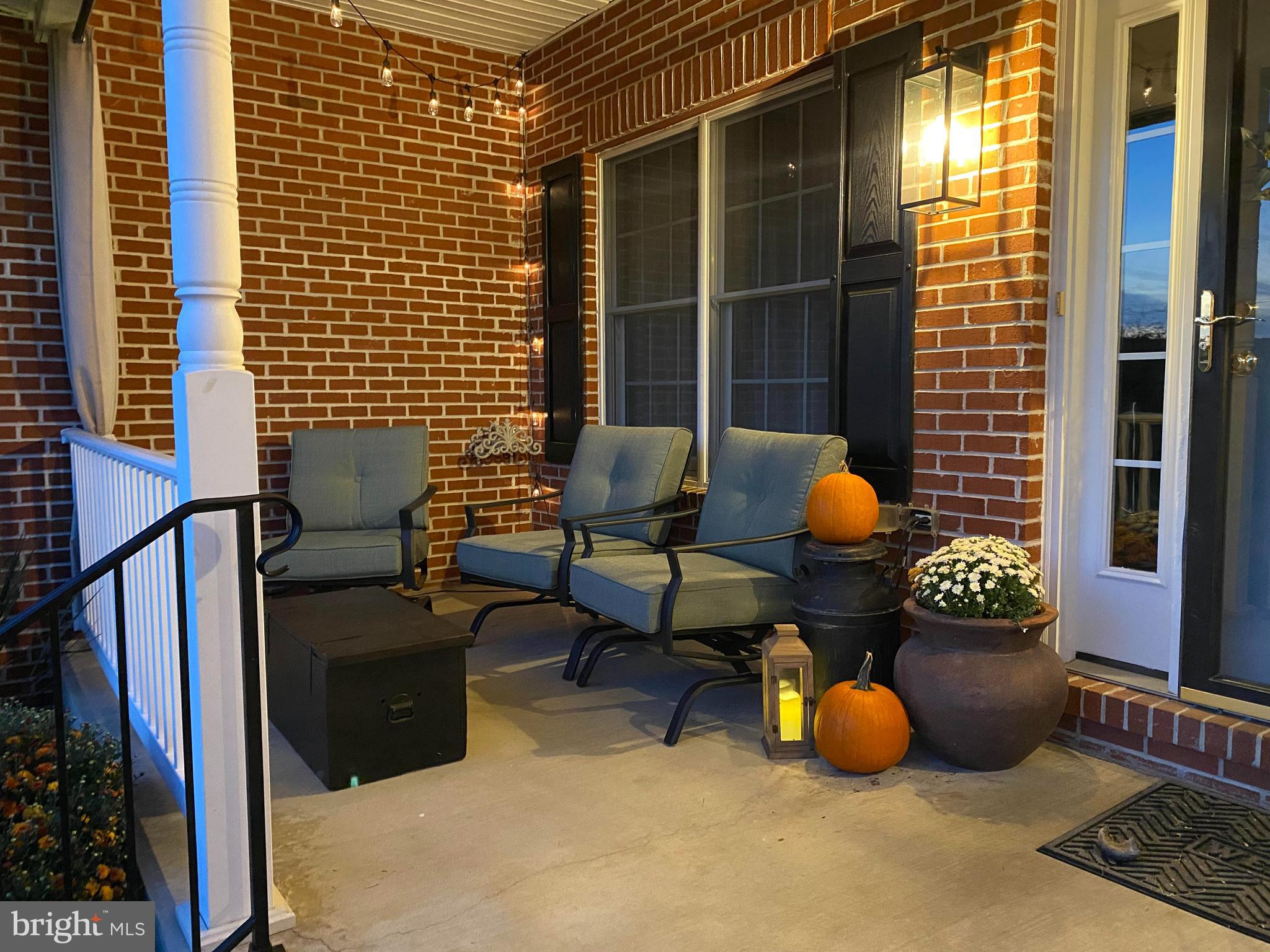 3723 Big Woods Road Ijamsville, MD 21754 - Photo 4 of 36 a outdoor living space with patio furniture and a potted plant