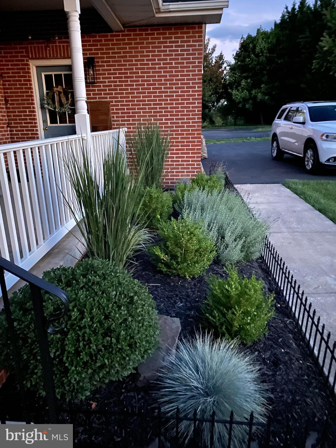 3723 Big Woods Road Ijamsville, MD 21754 - Photo 7 of 36 a front view of a house with garden
